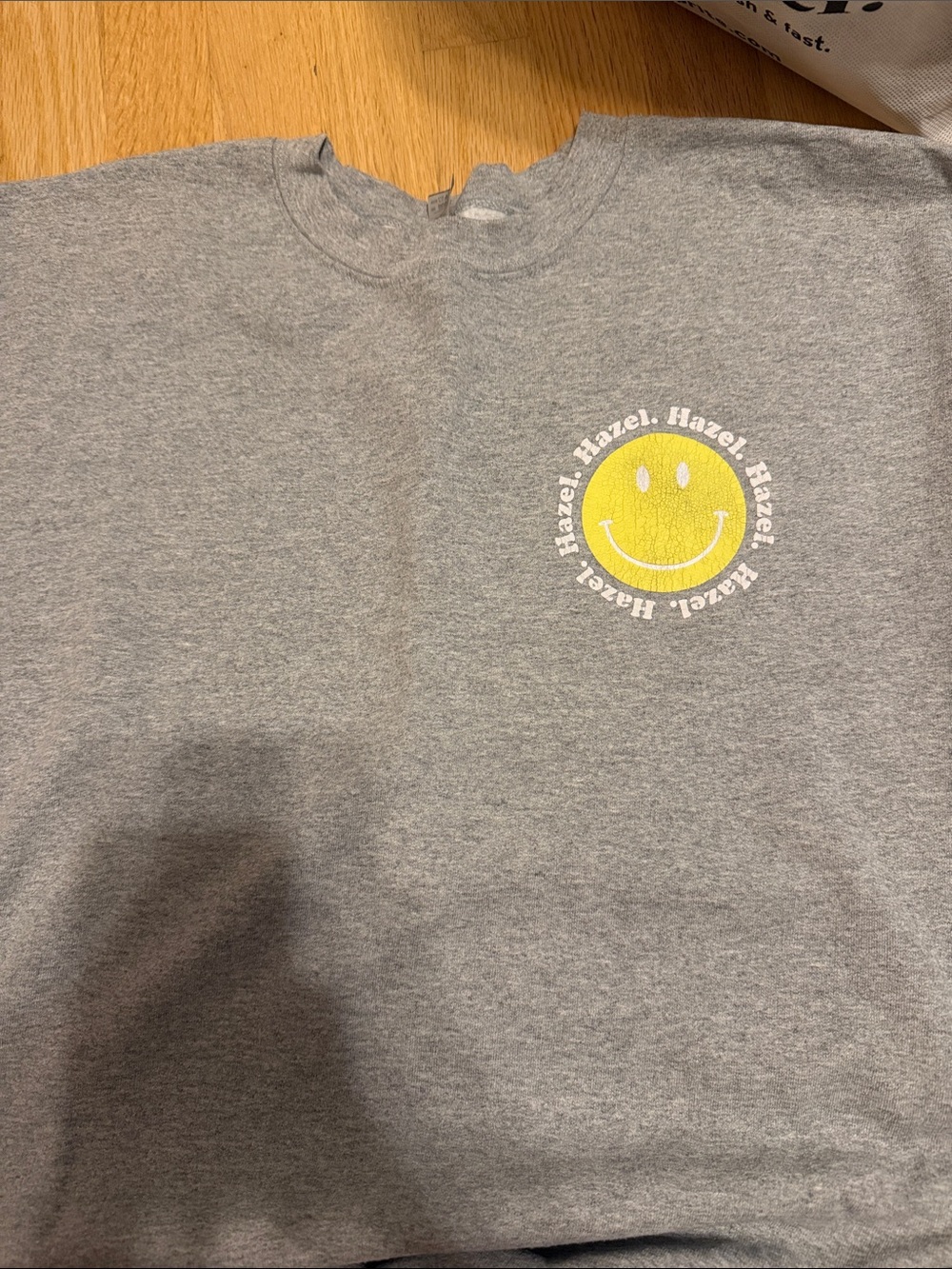 hazel Gray Sweatshirt with Yellow Smile Graphic